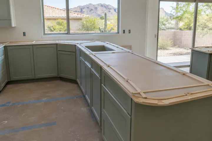 Countertop templates made of thin strips laid on new base cabinets before fabrication